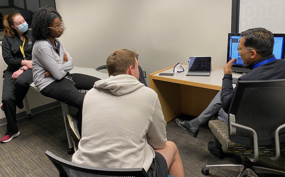 a group of people having a discussion in the VR Zone