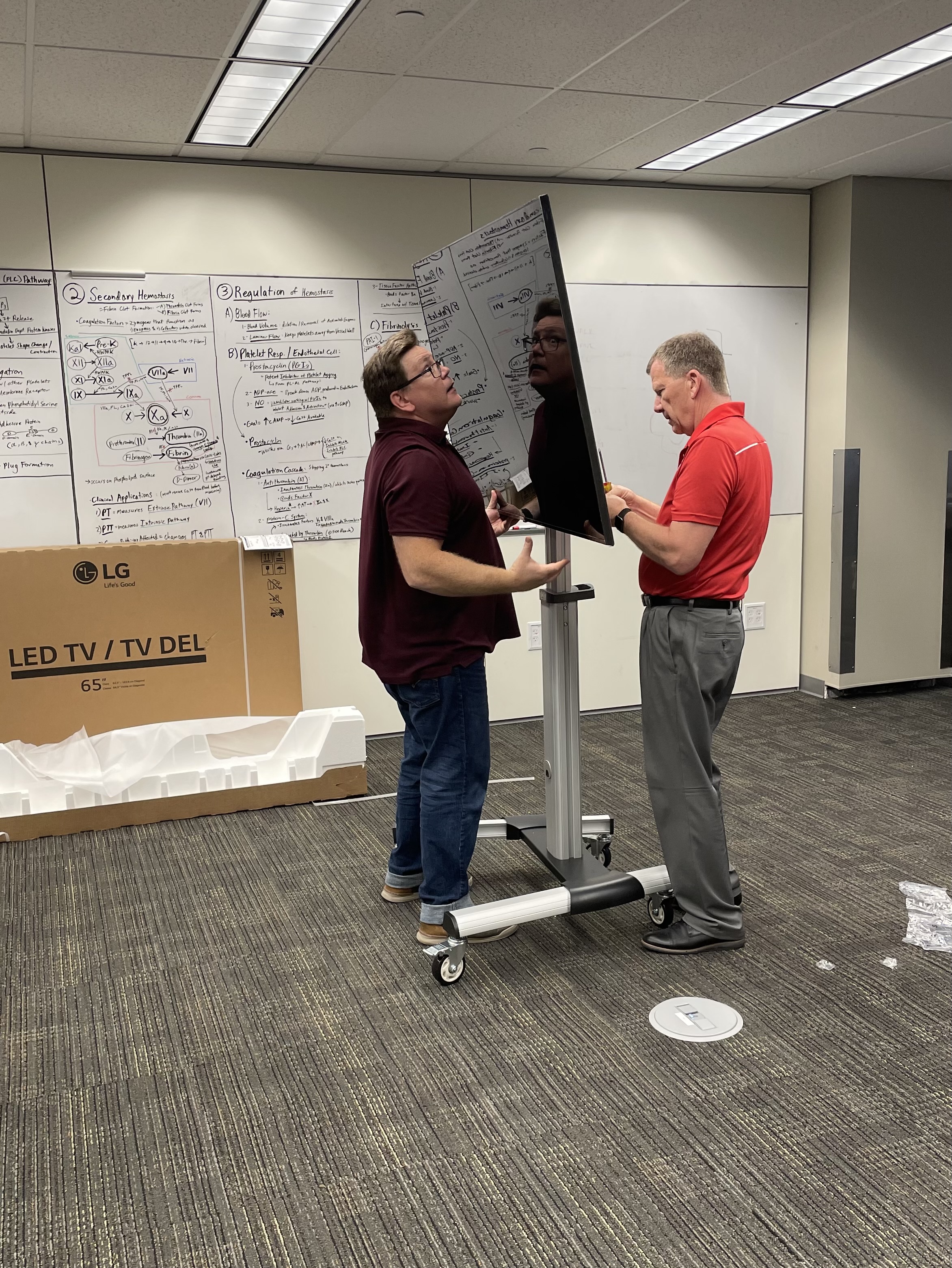 Dr. Doug Danforth and Kellen Maicher from The Ohio State University College of Medicine install a TV in the EdTech Incubator VR Zone.