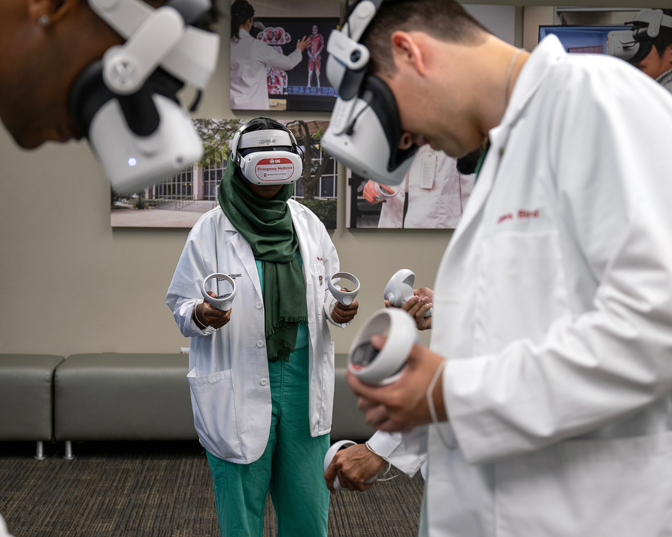 Medical students using VR headsets and handheld devices.