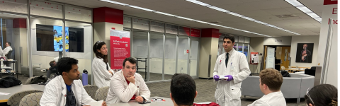 Dr. Nassani debriefs with dental students after class