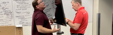 Dr. Doug Danforth and Kellen Maicher from The Ohio State University College of Medicine install a TV in the EdTech Incubator VR Zone.