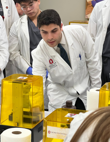 Dr. Nassani teaches dental students how to use 3D resin printers