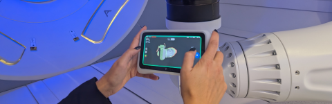 Person scanning proton therapy machine with the Einstar Vega handheld 3D scanner from the EdTech Incubator.