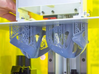 Printed models on 3D printer close-up.