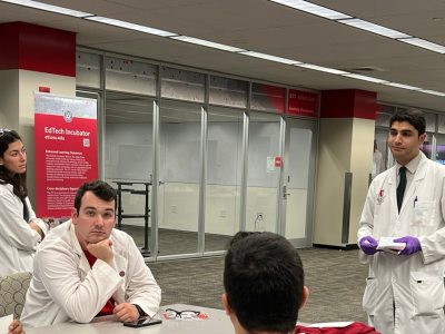 Dr. Nassani instructing students.