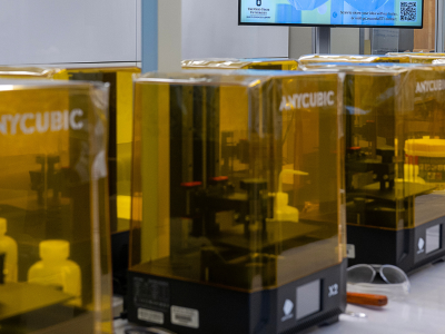 Row of 3D printers.