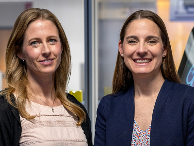 Kristin Roberts and Laura Boucher stand beside The Ohio State University Health Sciences Library's EdTech Incubator's anatomy Sectra table