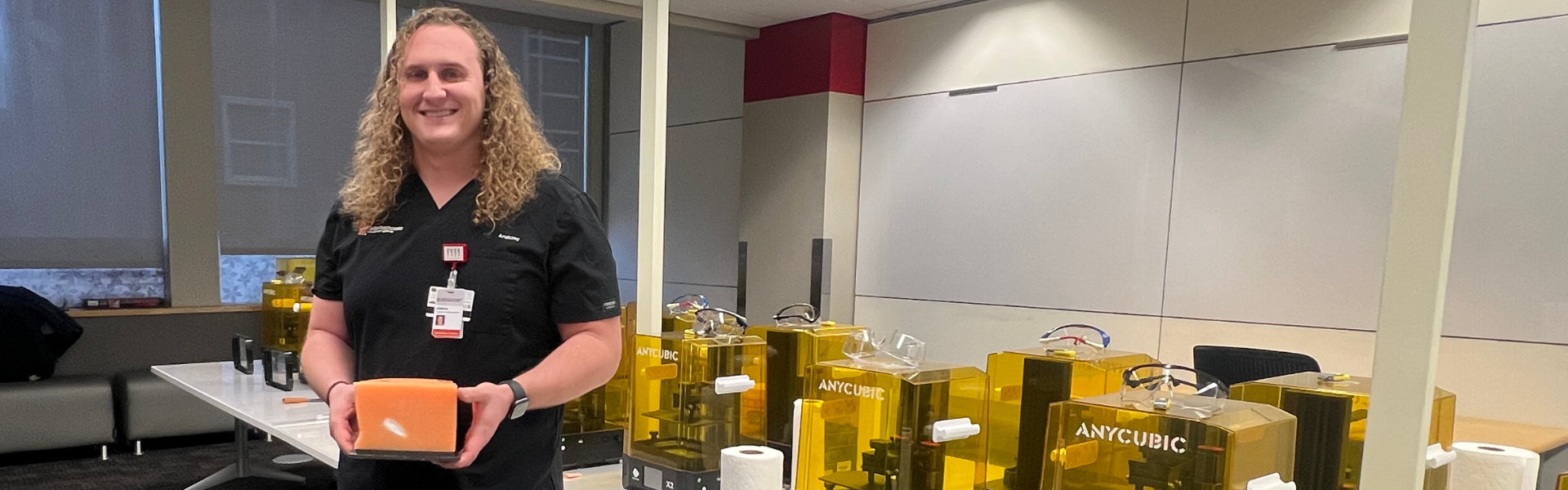 Joshua Krech holds a 3D printed model in the EdTech Incubator's 3D printing lab