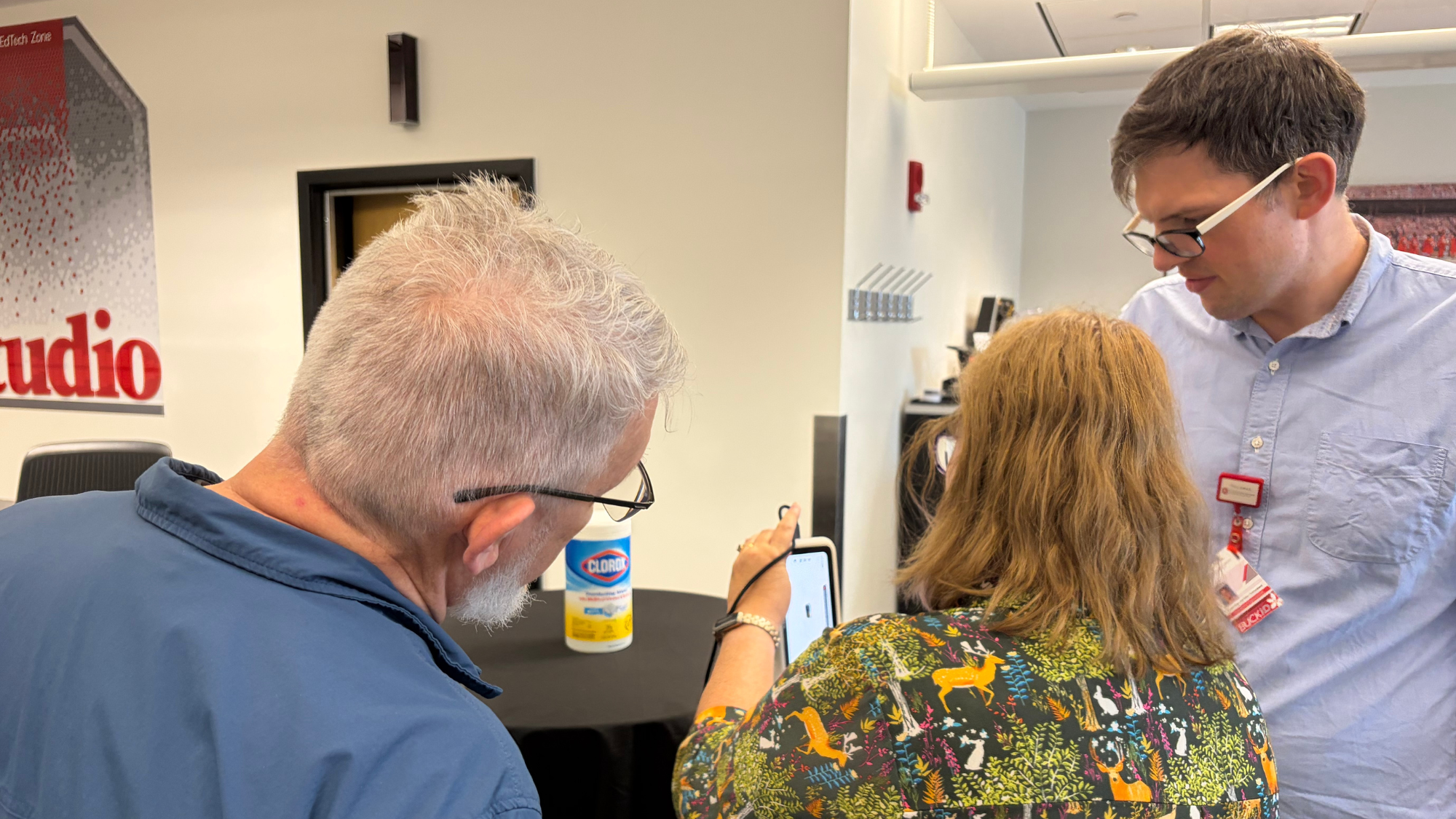 Group scanning a Clorox wipe container.