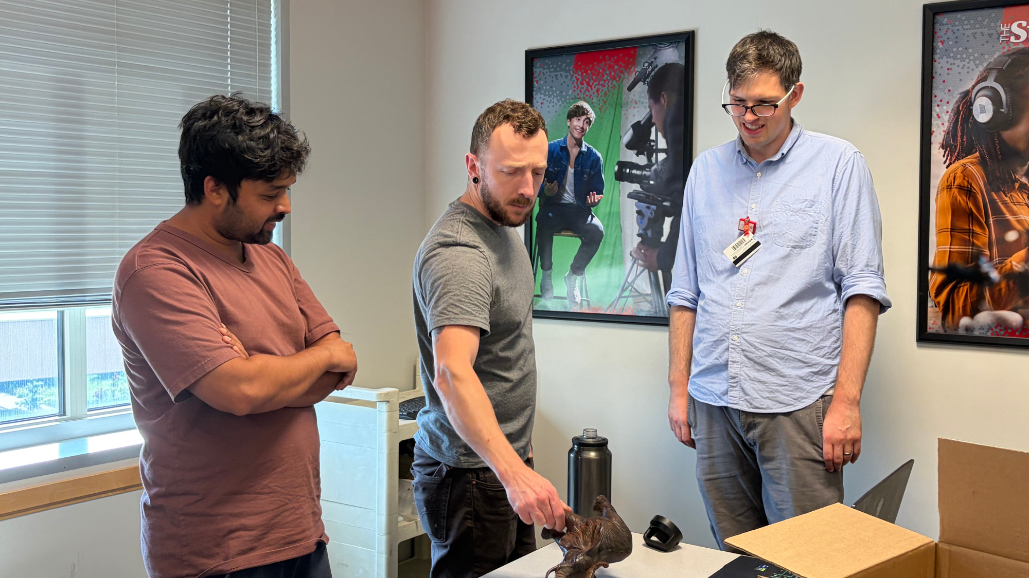 Group looking at an object to scan.