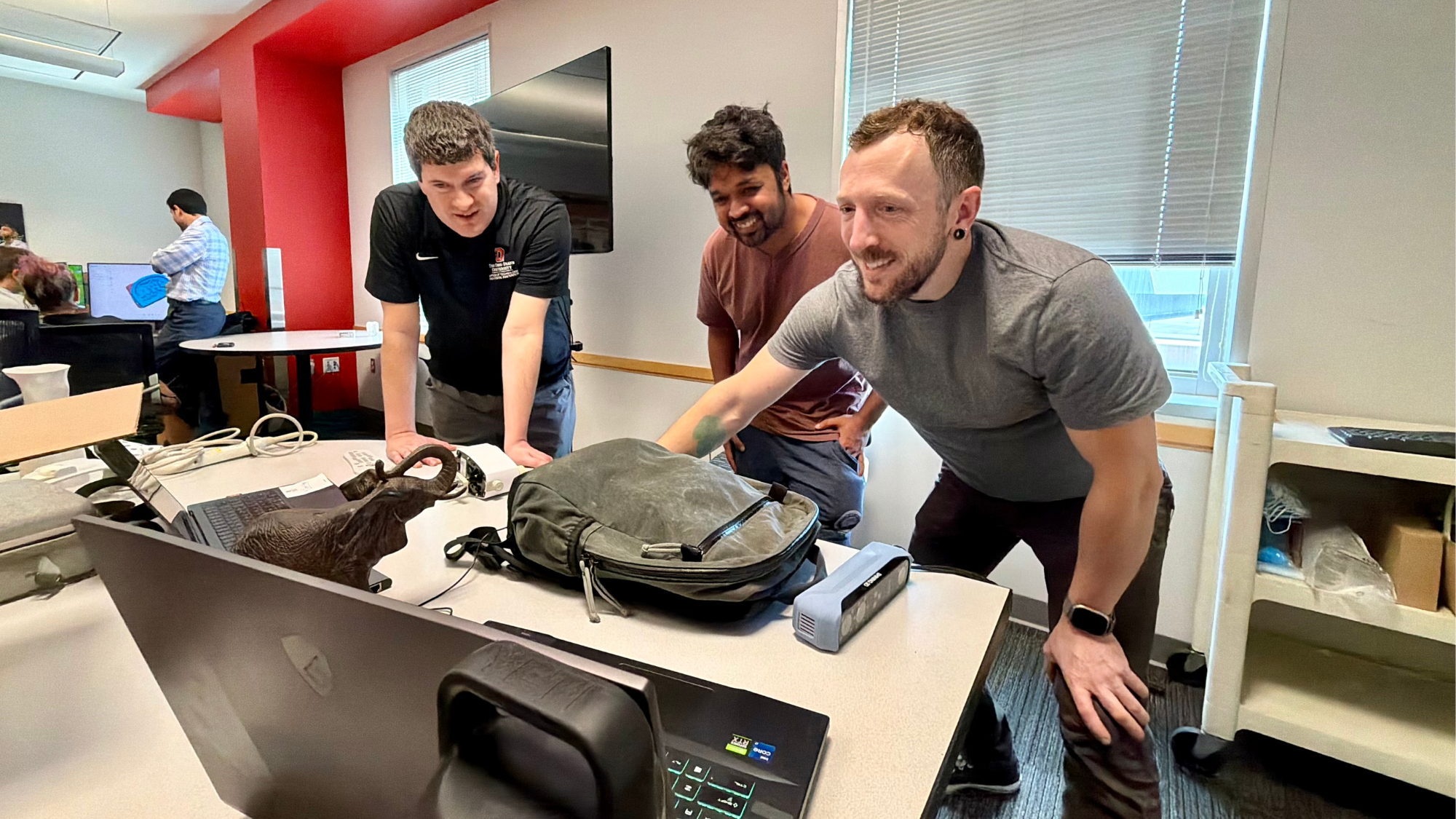 Group working on laptop.