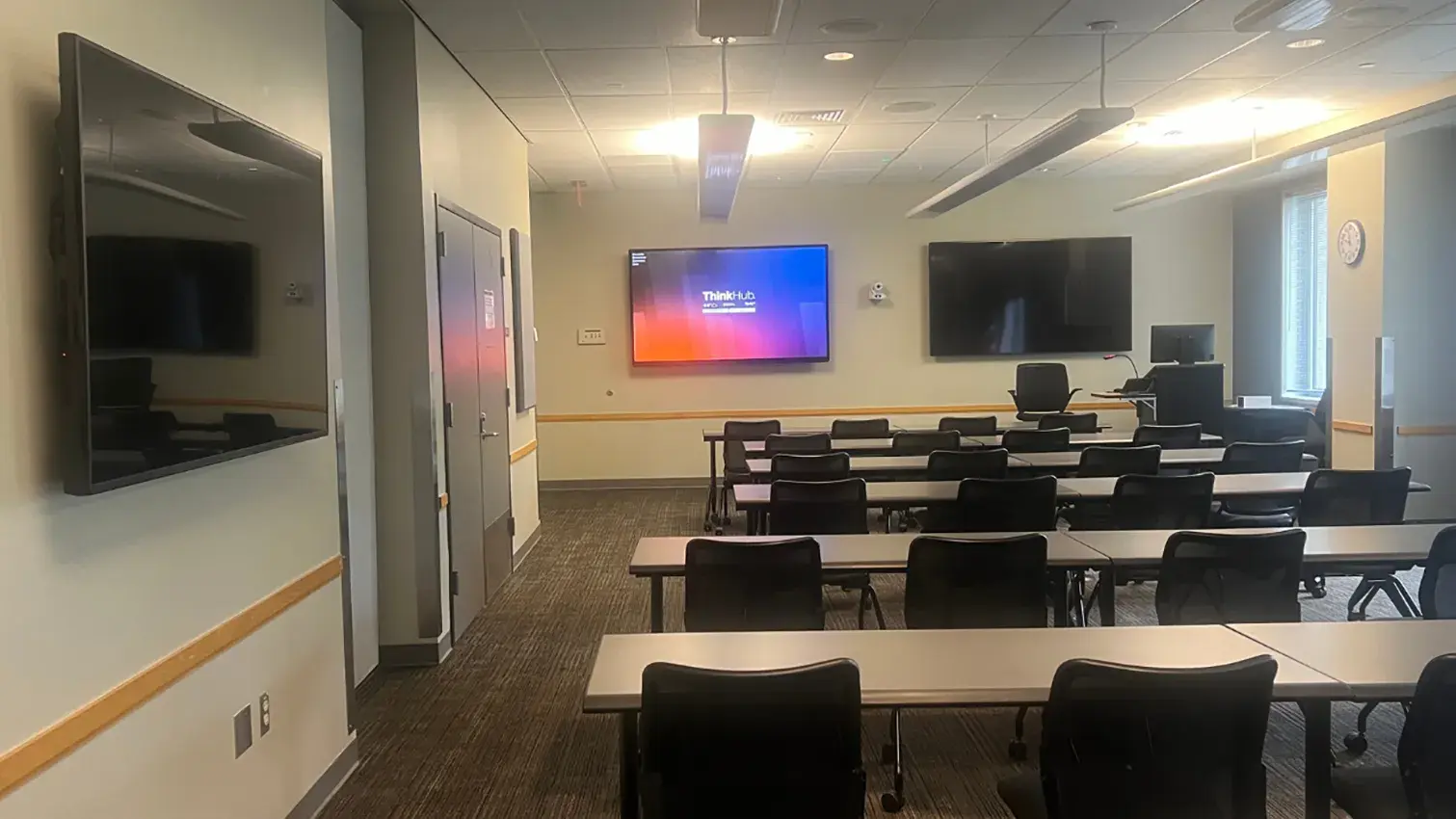 technology enabled classroom with large screen tvs